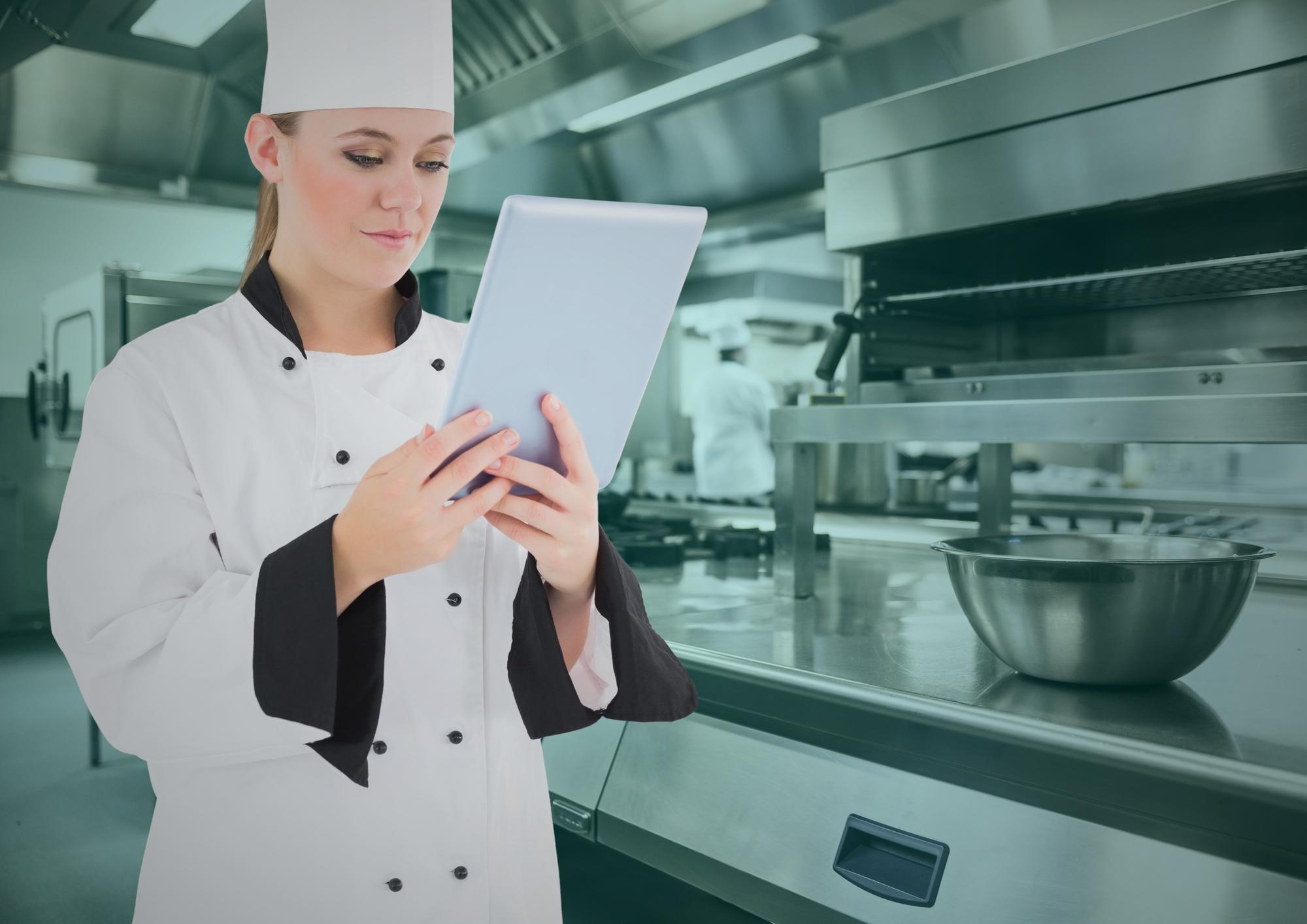 Chef auditing kitchen workflow